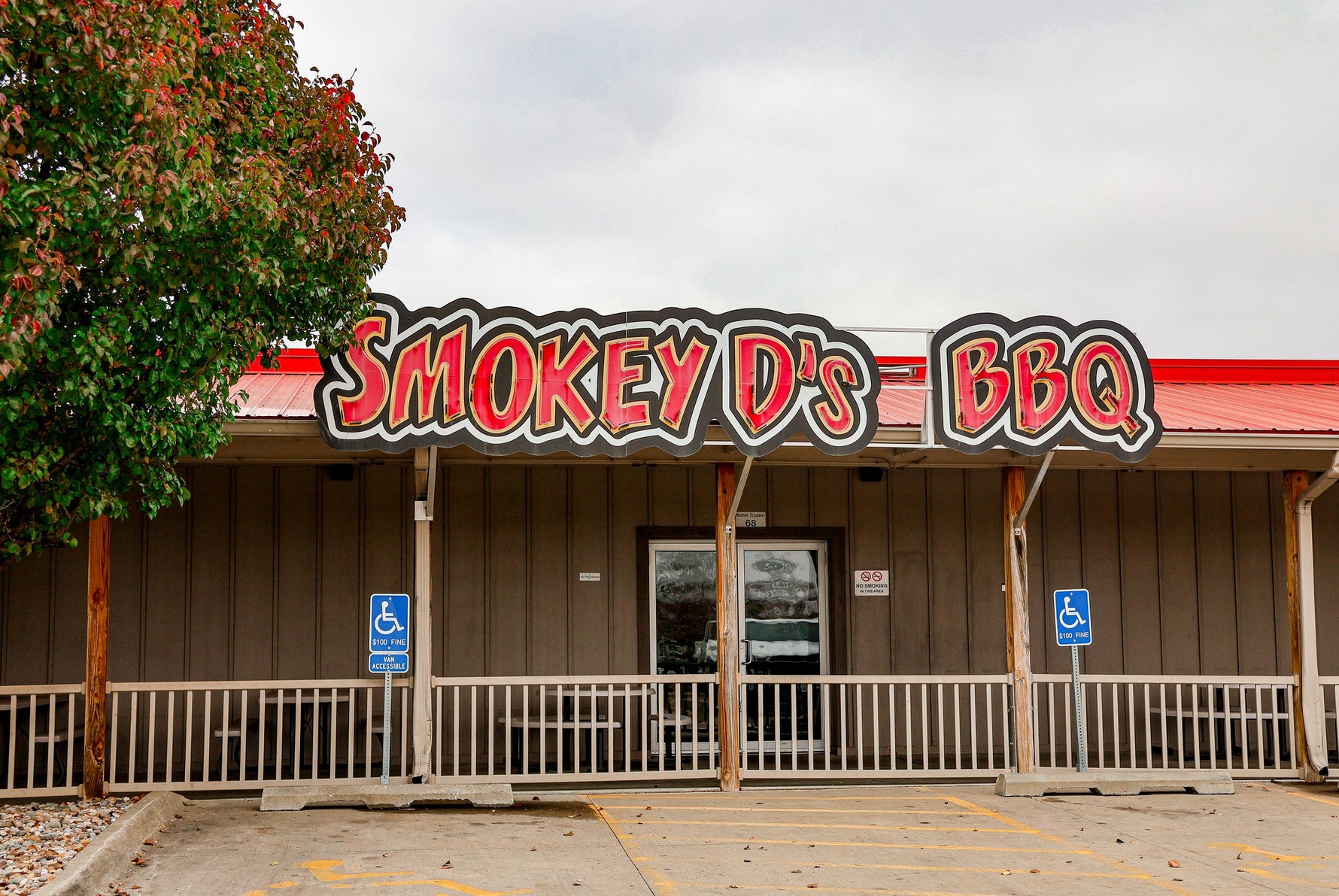 Smokey D's BBQ restaurant with a red roof and sign.
