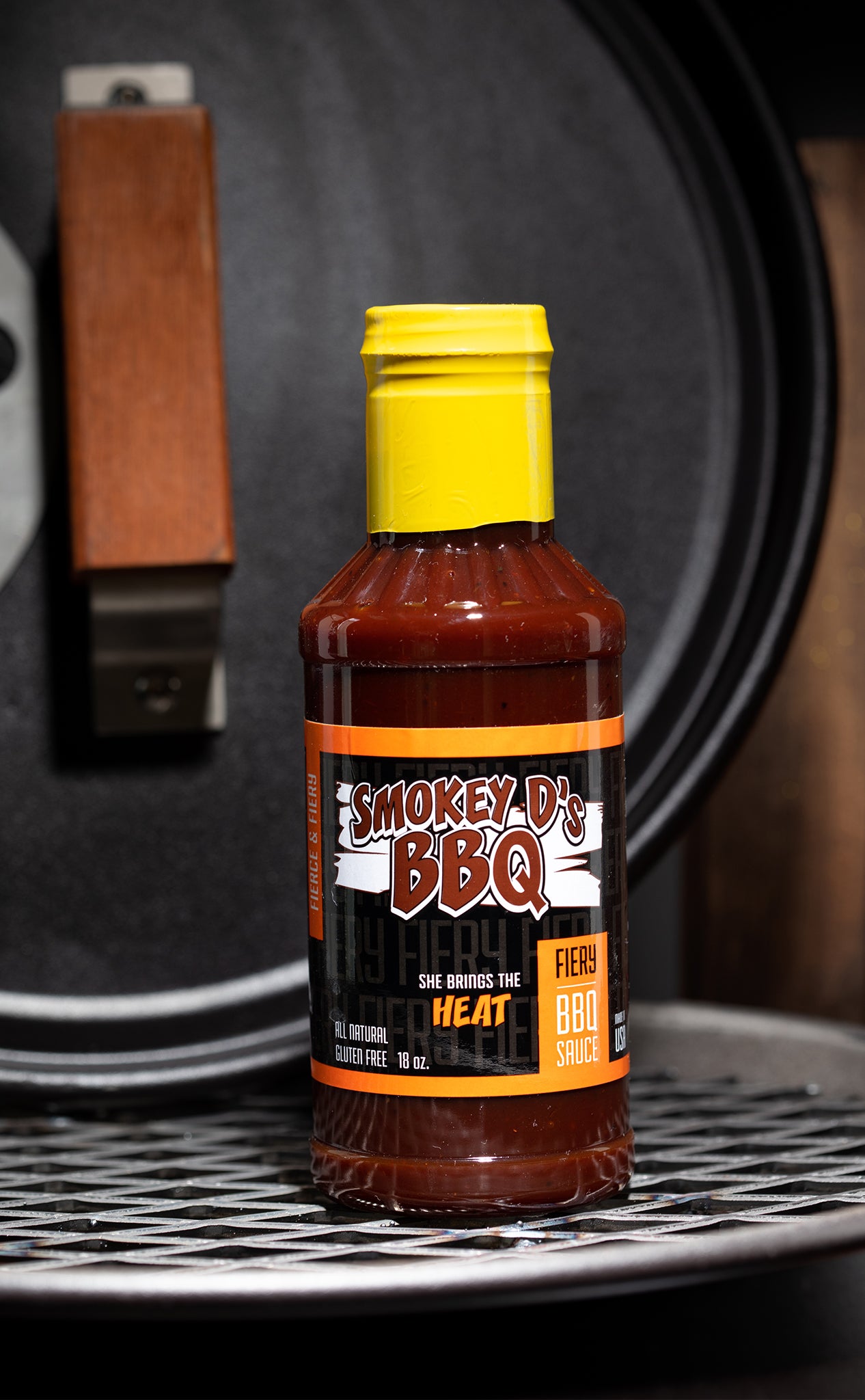 Photo of Smokey D's BBQ sauce - label reads, "Fiery | She's Brings the HEAT!"