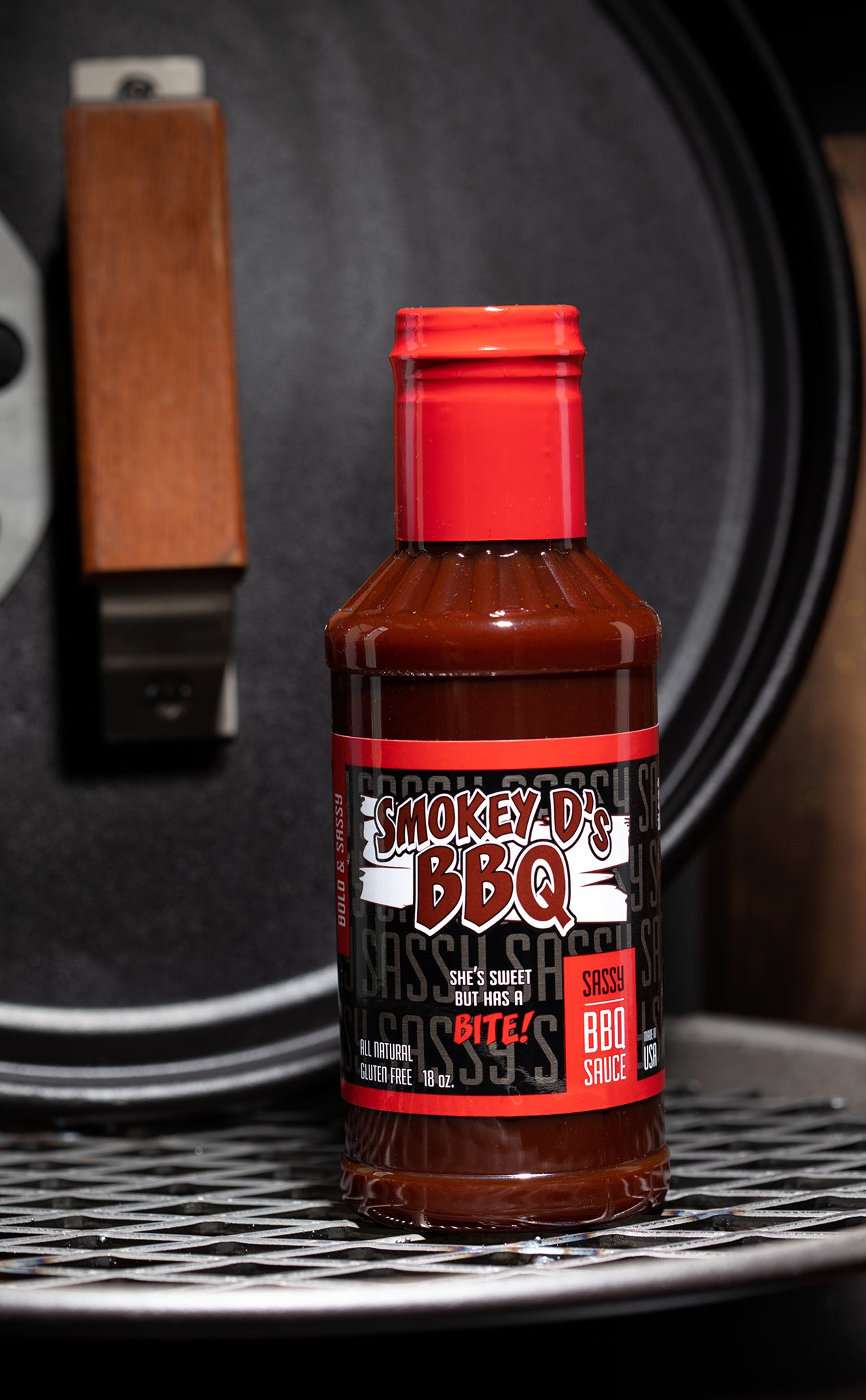 Photo of Smokey D's BBQ sauce - label reads, "Sassy | She's Sweet But Has a BITE!"